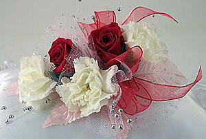 mini carnations and sweetheart rose corsages